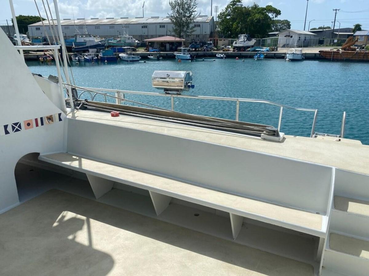 a white boat in a harbor aboard 1996 GOLD COAST GC 70 Yacht for Sale