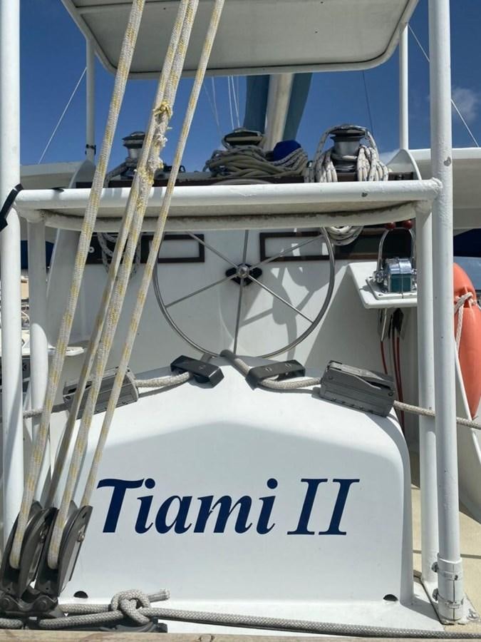 a white metal frame with a blue sign and a white pole aboard 1996 GOLD COAST GC 70 Yacht for Sale