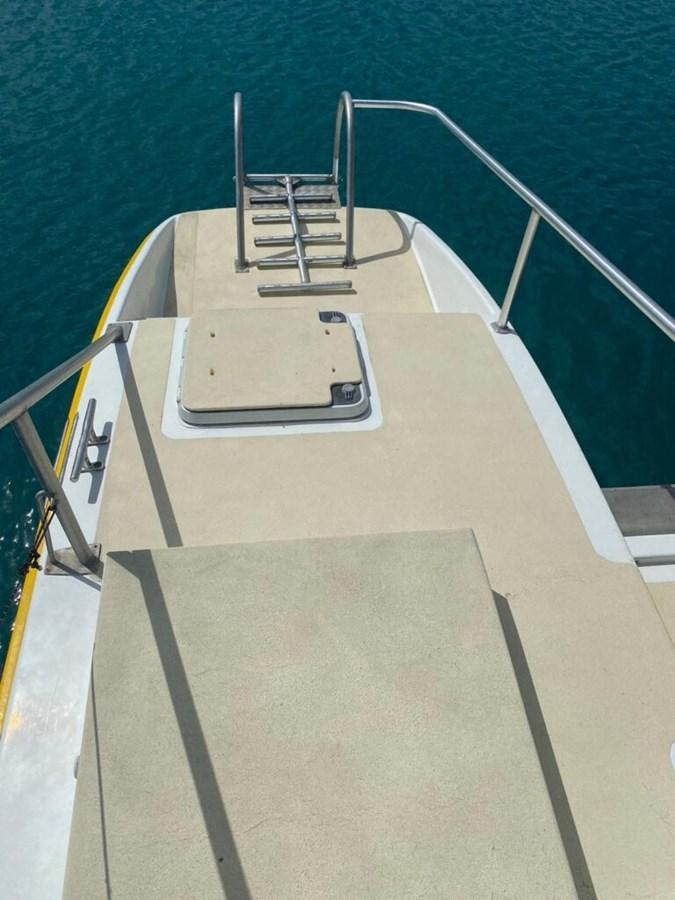 a white rectangular object with a metal frame on a wooden surface aboard 1996 GOLD COAST GC 70 Yacht for Sale