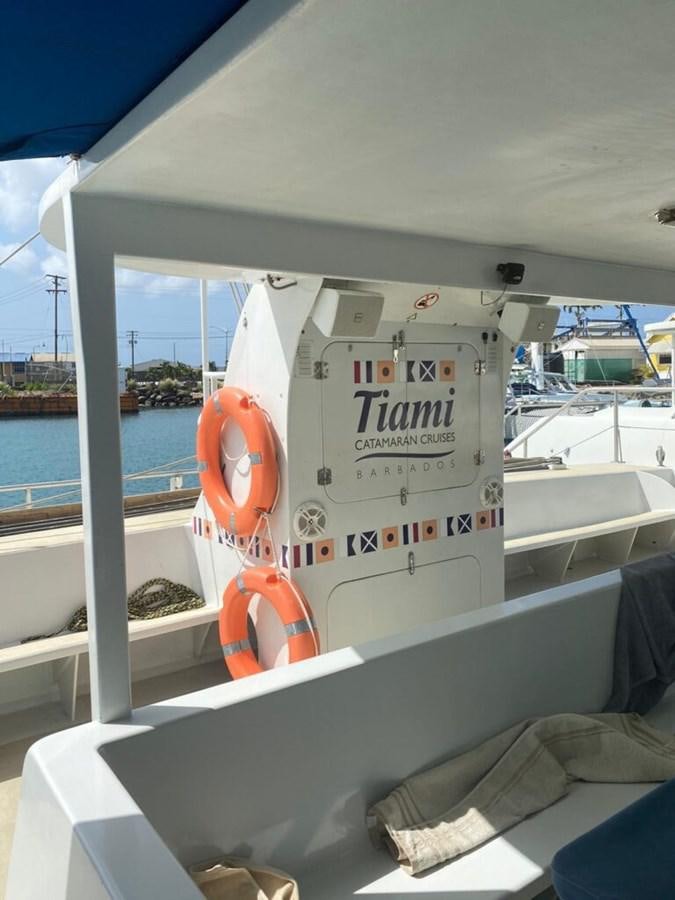 a boat with orange life vests aboard 1996 GOLD COAST GC 70 Yacht for Sale