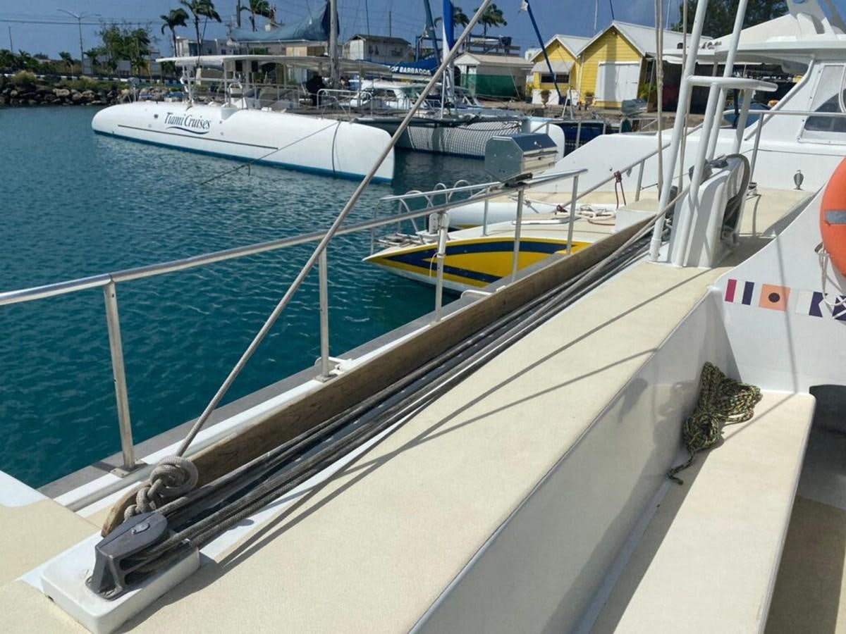 a boat tied to a dock aboard 1996 GOLD COAST GC 70 Yacht for Sale