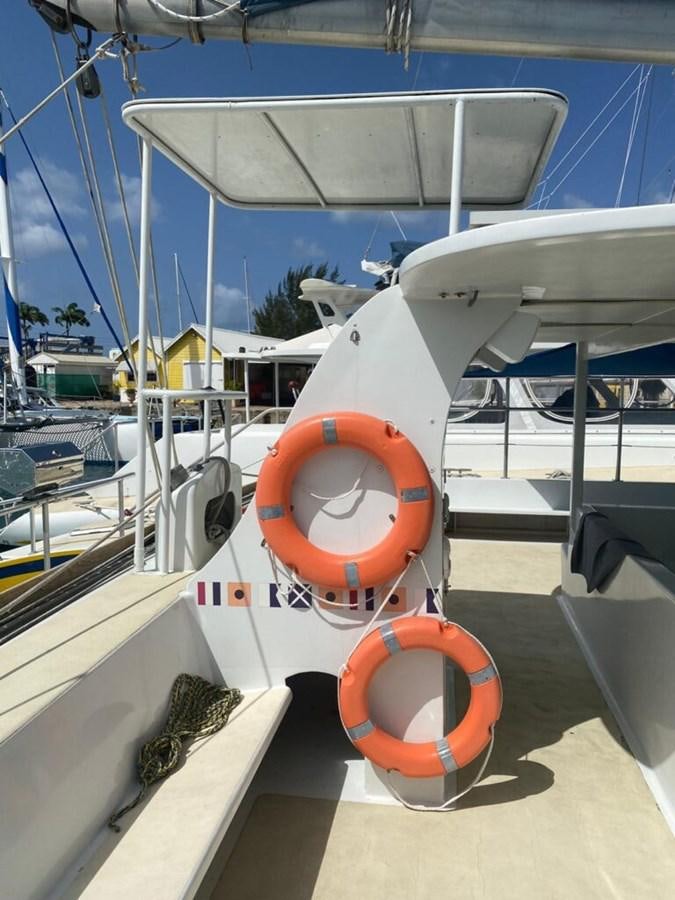 a white and orange boat aboard 1996 GOLD COAST GC 70 Yacht for Sale