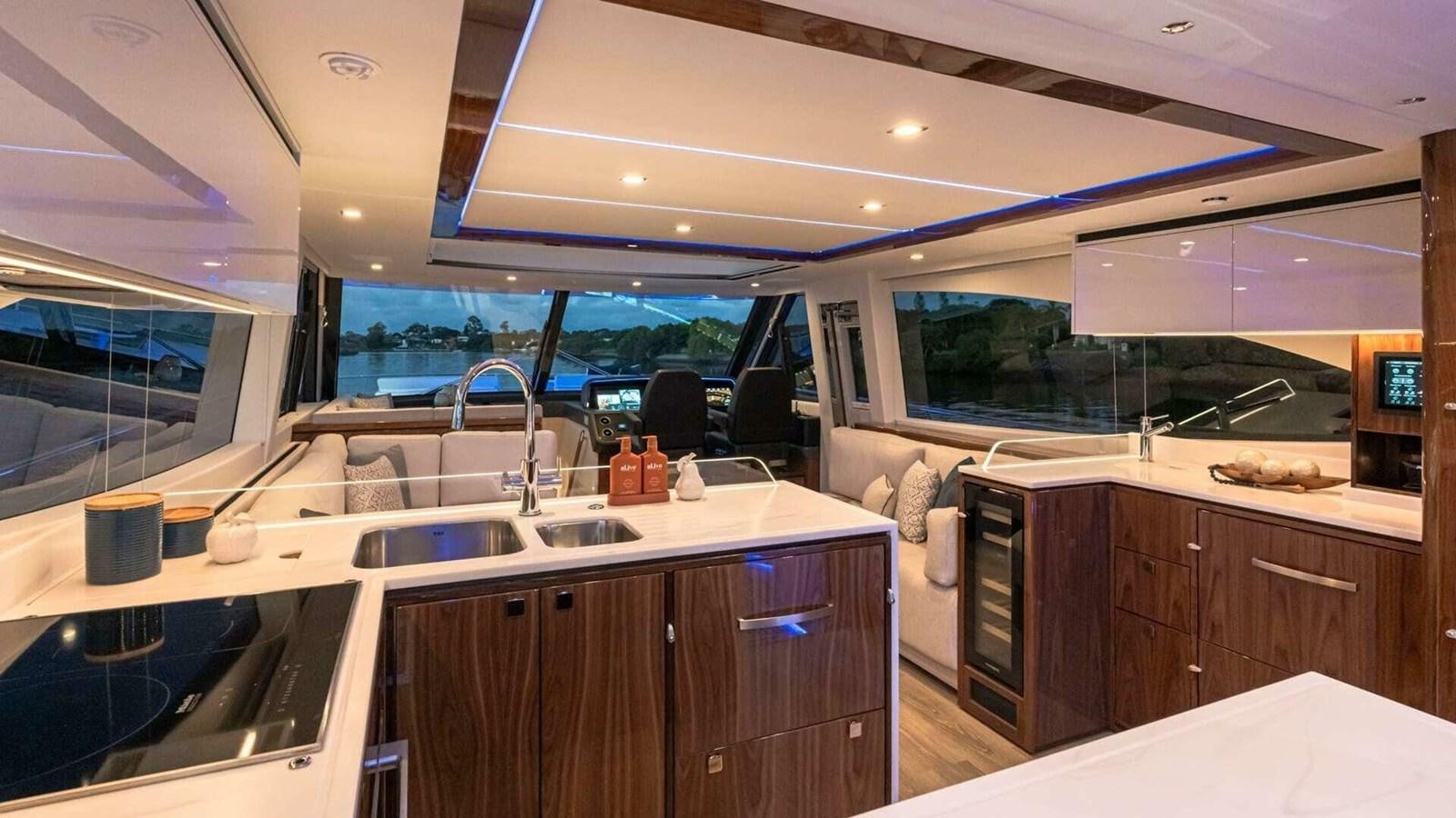 a kitchen with a sink and cabinets aboard 6800 SPORT  PLATINUM Yacht for Sale