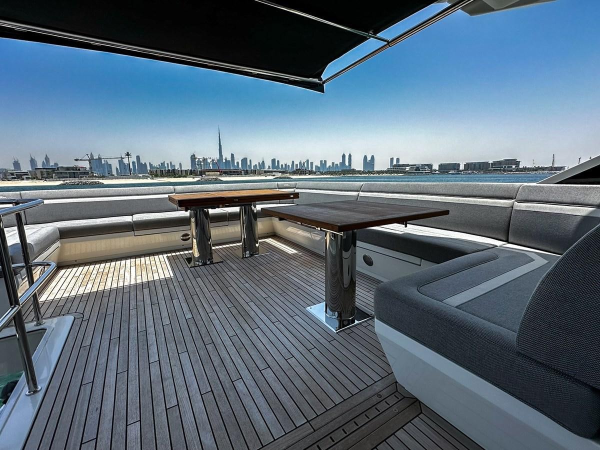 a deck with a view of a city and a body of water aboard JANICE Yacht for Sale
