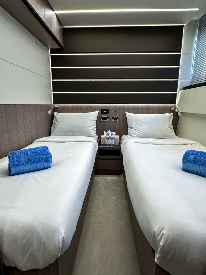 a room with two beds aboard JANICE Yacht for Sale