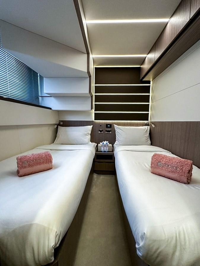 a couple of beds in a room aboard JANICE Yacht for Sale
