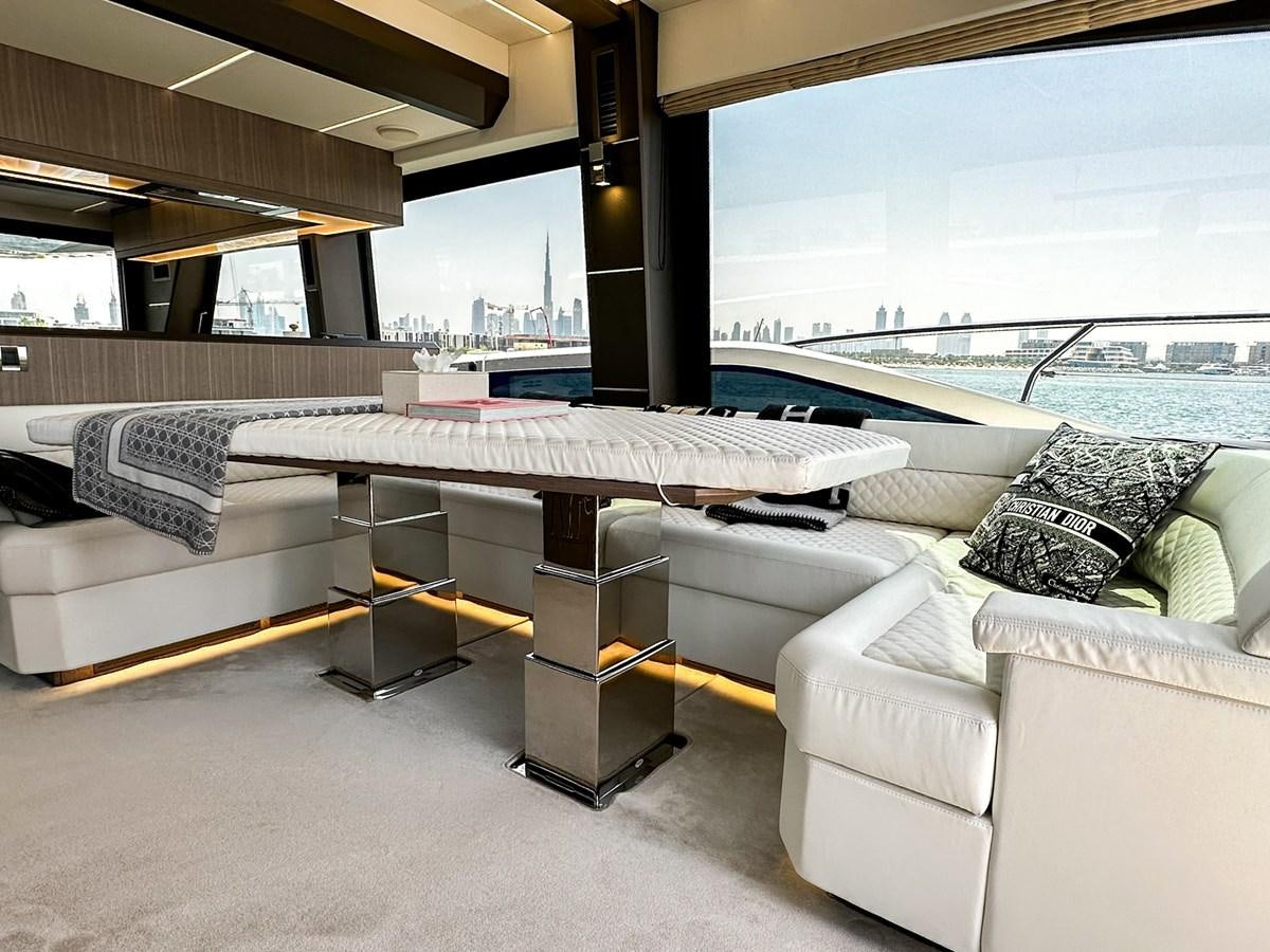 a room with a bed and a table aboard JANICE Yacht for Sale