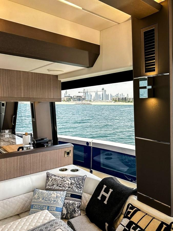 a living room with a large swimming pool aboard JANICE Yacht for Sale