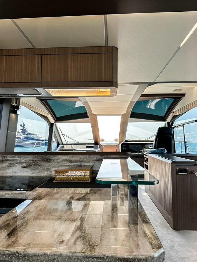 a room with a table and chairs aboard JANICE Yacht for Sale