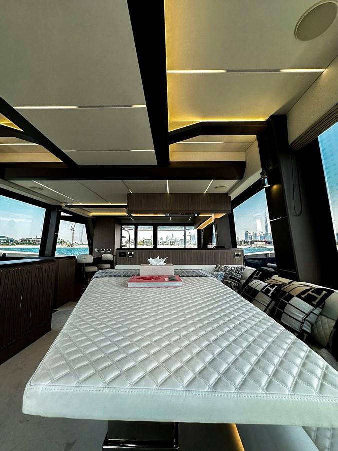 a large room with a table and chairs aboard JANICE Yacht for Sale