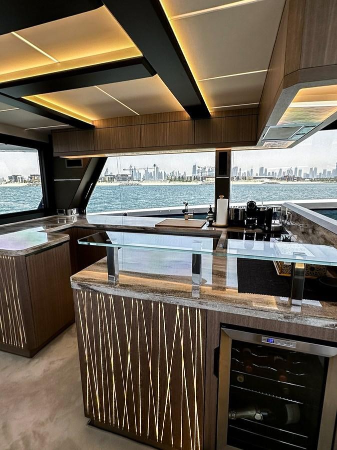 a kitchen with a large island aboard JANICE Yacht for Sale