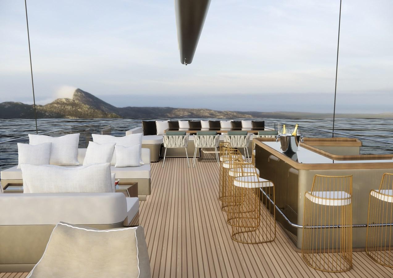 a deck with chairs and tables on it by the water aboard BOA KINGDOM Yacht for Sale