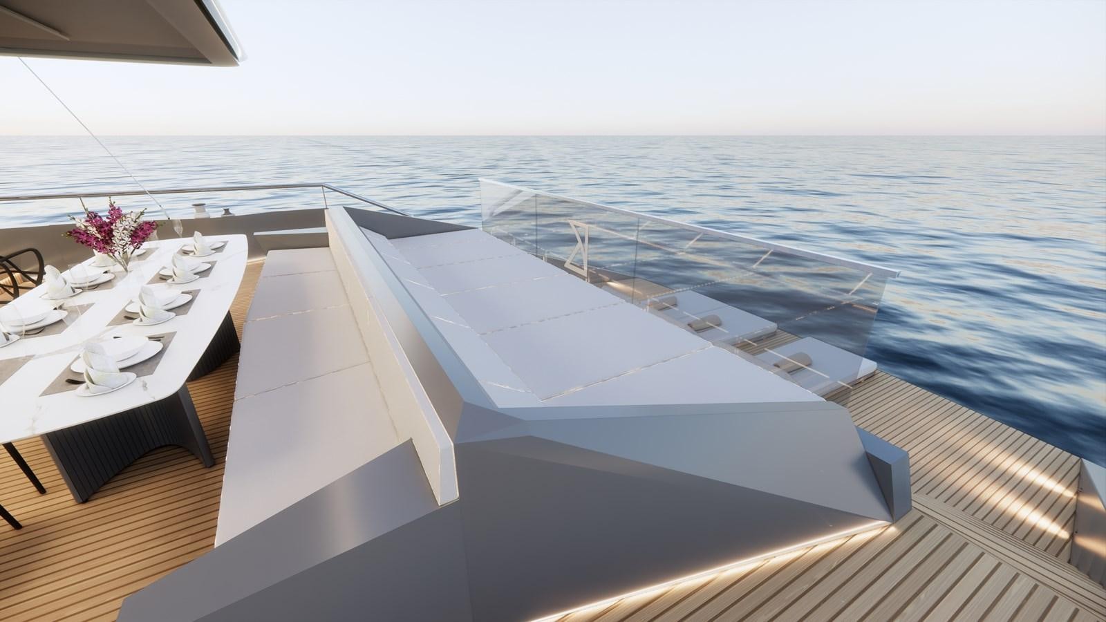 a white lounge chair on a deck overlooking the ocean aboard BOA KINGDOM Yacht for Sale