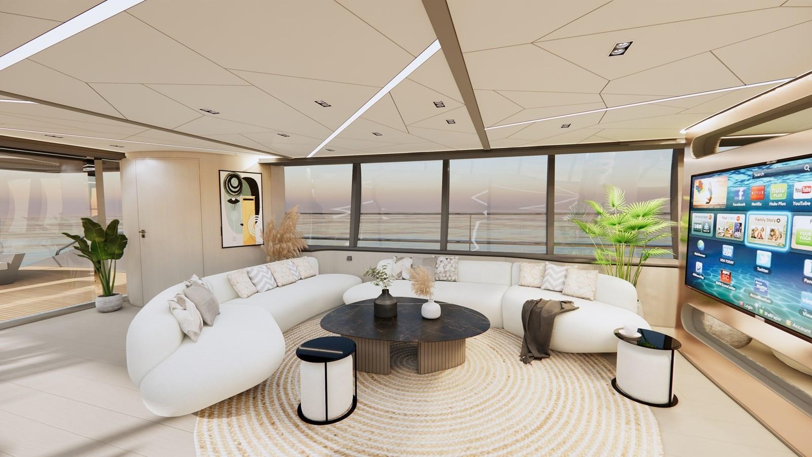 a living room with a large screen aboard BOA KINGDOM Yacht for Sale