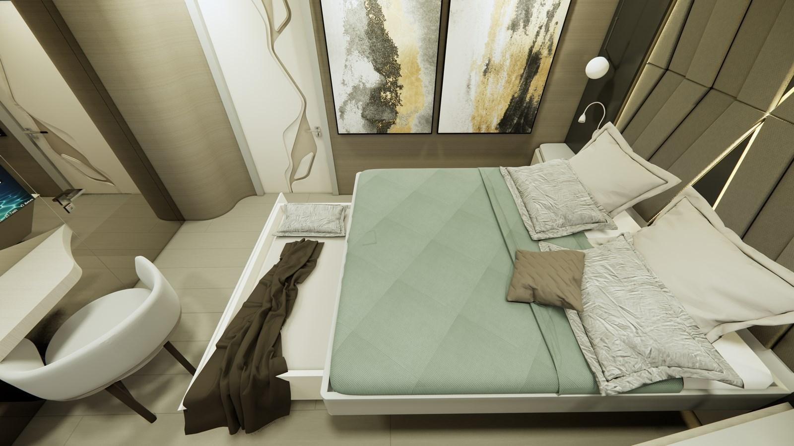a bed with a green sheet aboard BOA KINGDOM Yacht for Sale