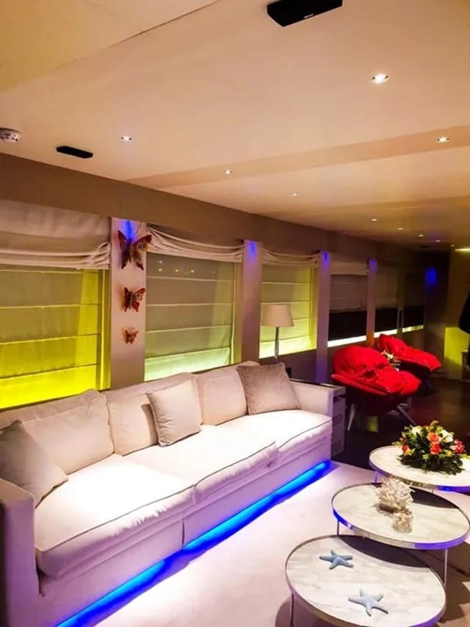 a living room with a large blue and white rug aboard AURORA Yacht for Sale
