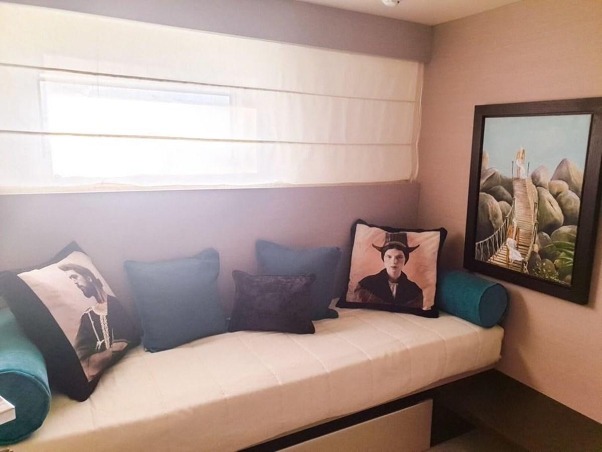 a couch with a picture on the wall aboard AURORA Yacht for Sale