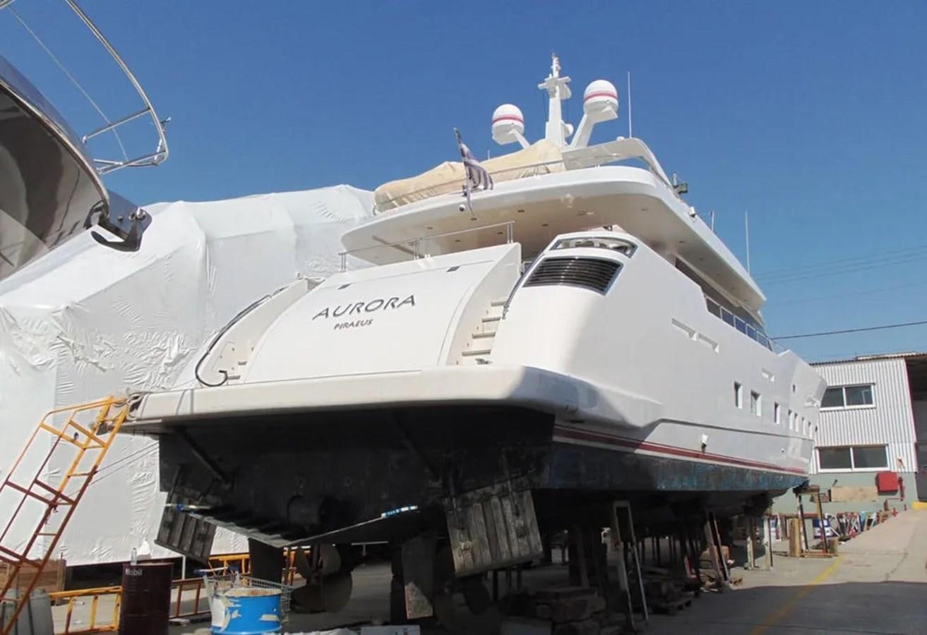 a large ship with a statue on top aboard AURORA Yacht for Sale