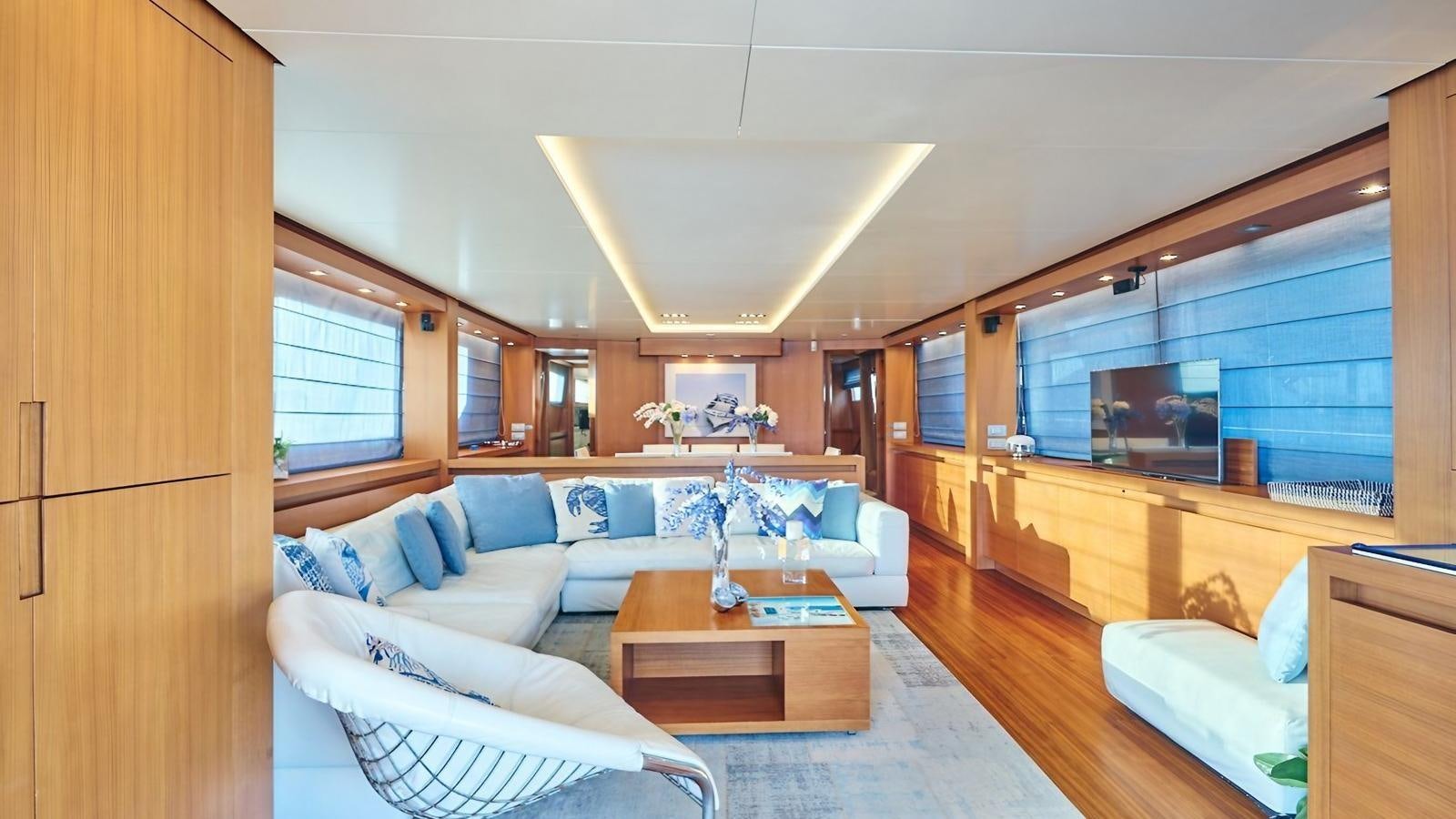 a living room with a large window aboard SUNRAY II Yacht for Sale