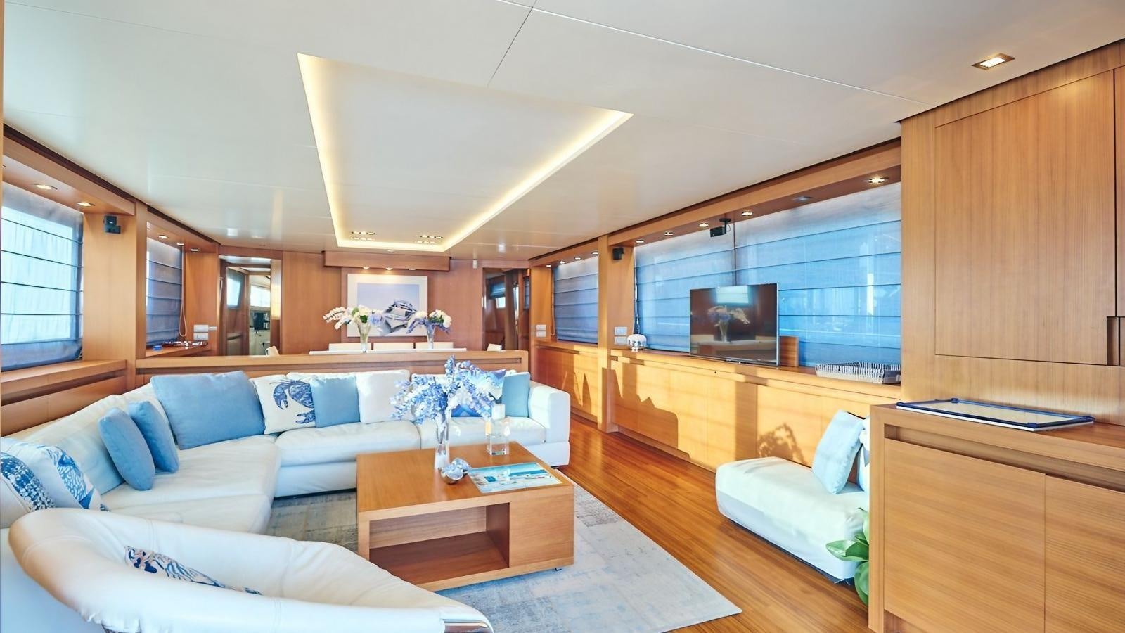 a living room with a couch and a table aboard SUNRAY II Yacht for Sale