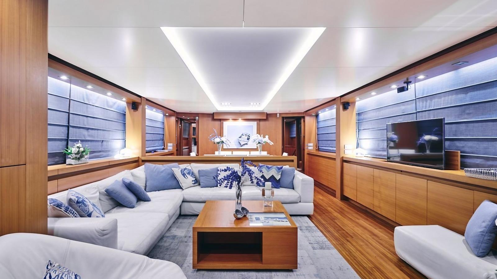a living room with a large sofa aboard SUNRAY II Yacht for Sale