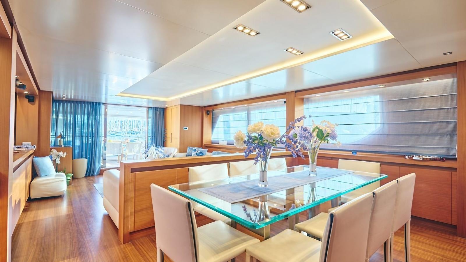 a dining room with a table and chairs aboard SUNRAY II Yacht for Sale