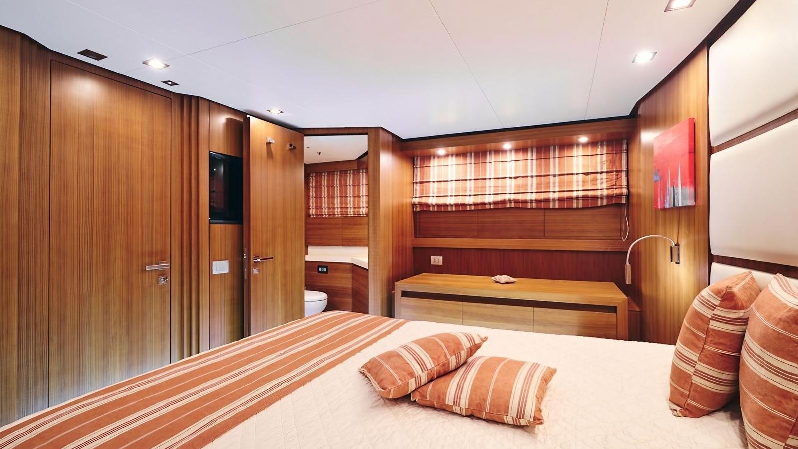 a bed in a room aboard SUNRAY II Yacht for Sale