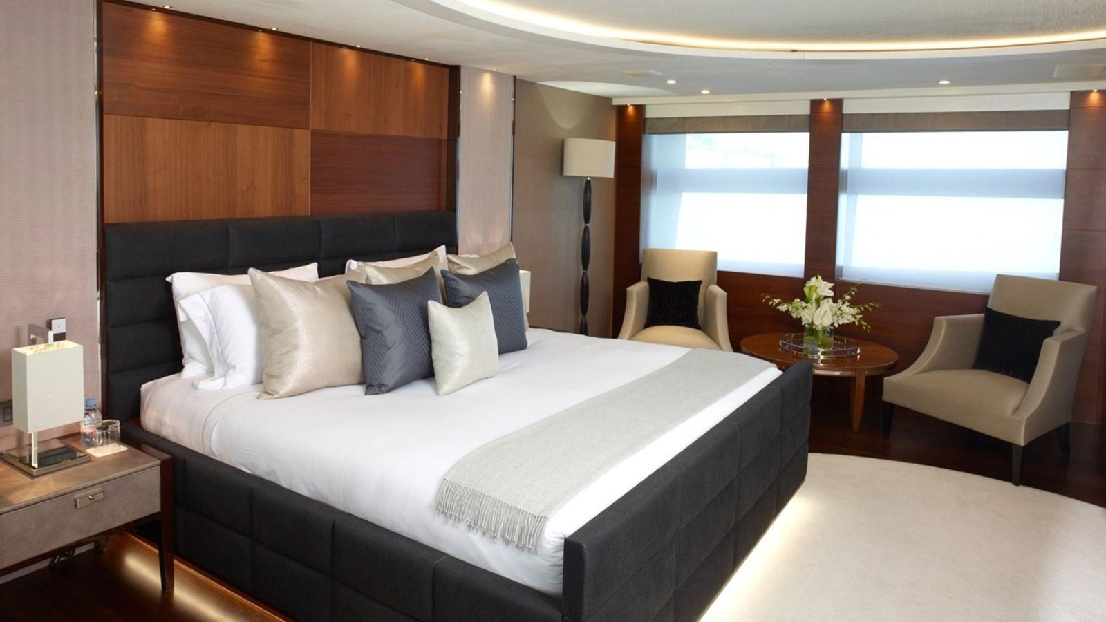 a bed with white sheets and pillows aboard IMPERIAL PRINCESS BEATRICE Yacht for Sale