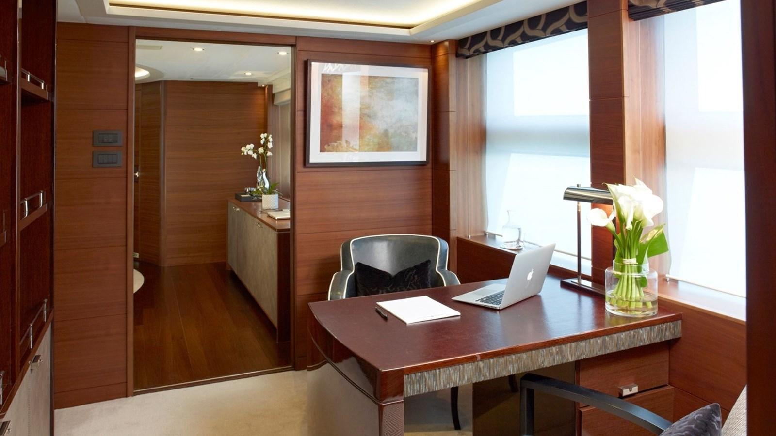 a room with a table and chairs aboard IMPERIAL PRINCESS BEATRICE Yacht for Sale