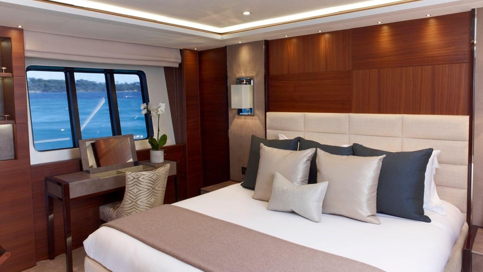 a bed with white sheets and pillows aboard IMPERIAL PRINCESS BEATRICE Yacht for Sale
