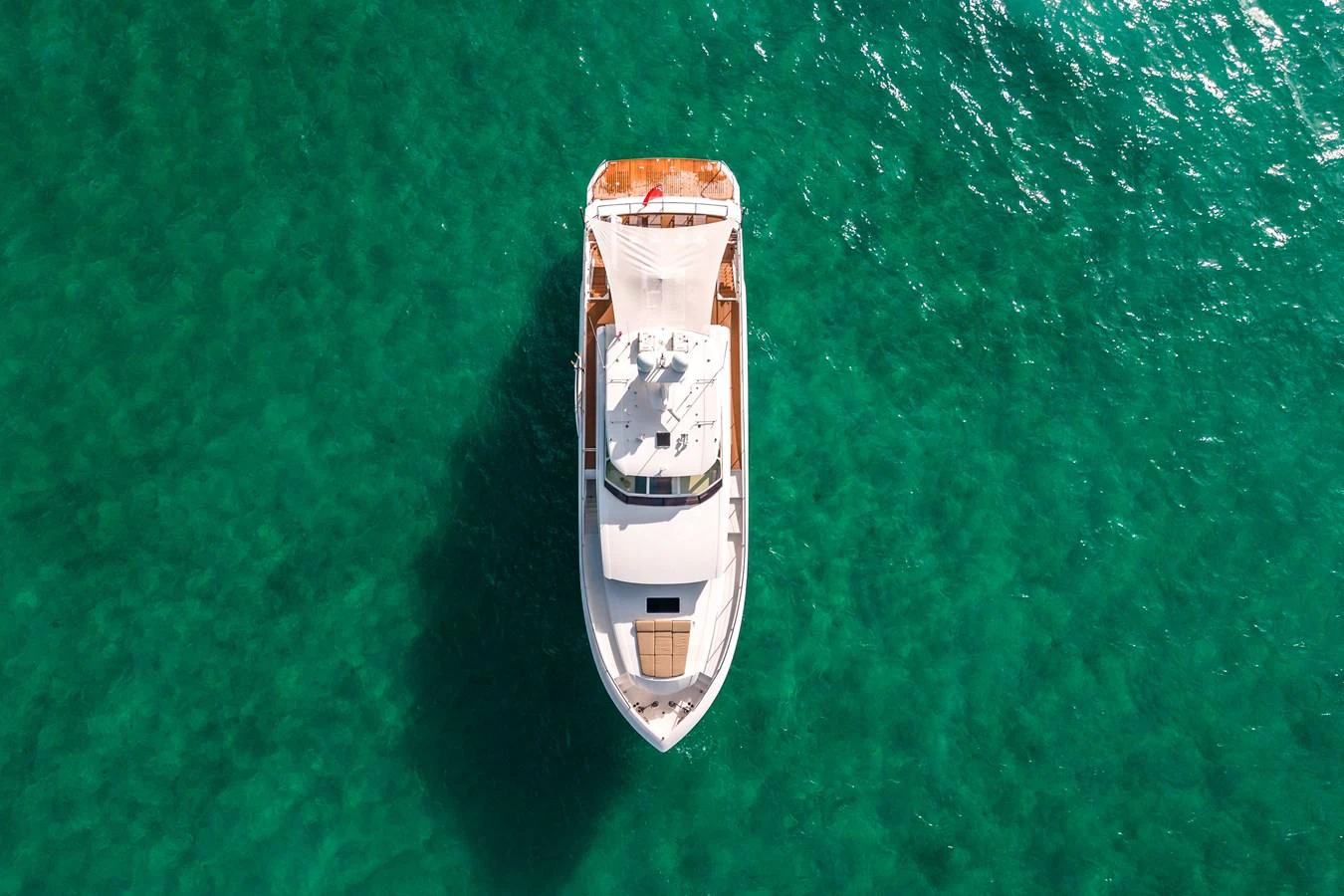 a white and orange boat in the water aboard MIDNIGHT MOON Yacht for Sale