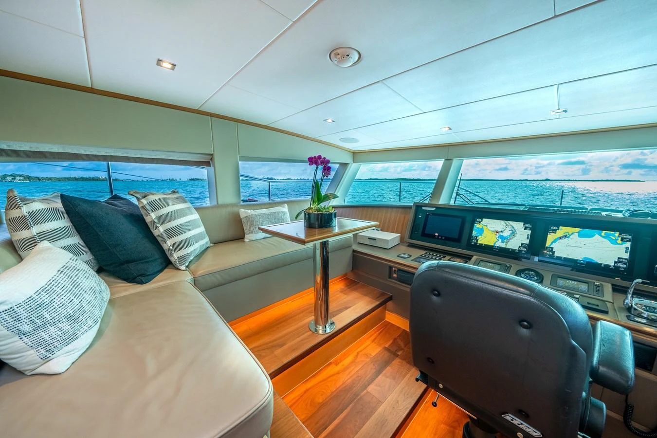 a living room with a large window aboard MIDNIGHT MOON Yacht for Sale