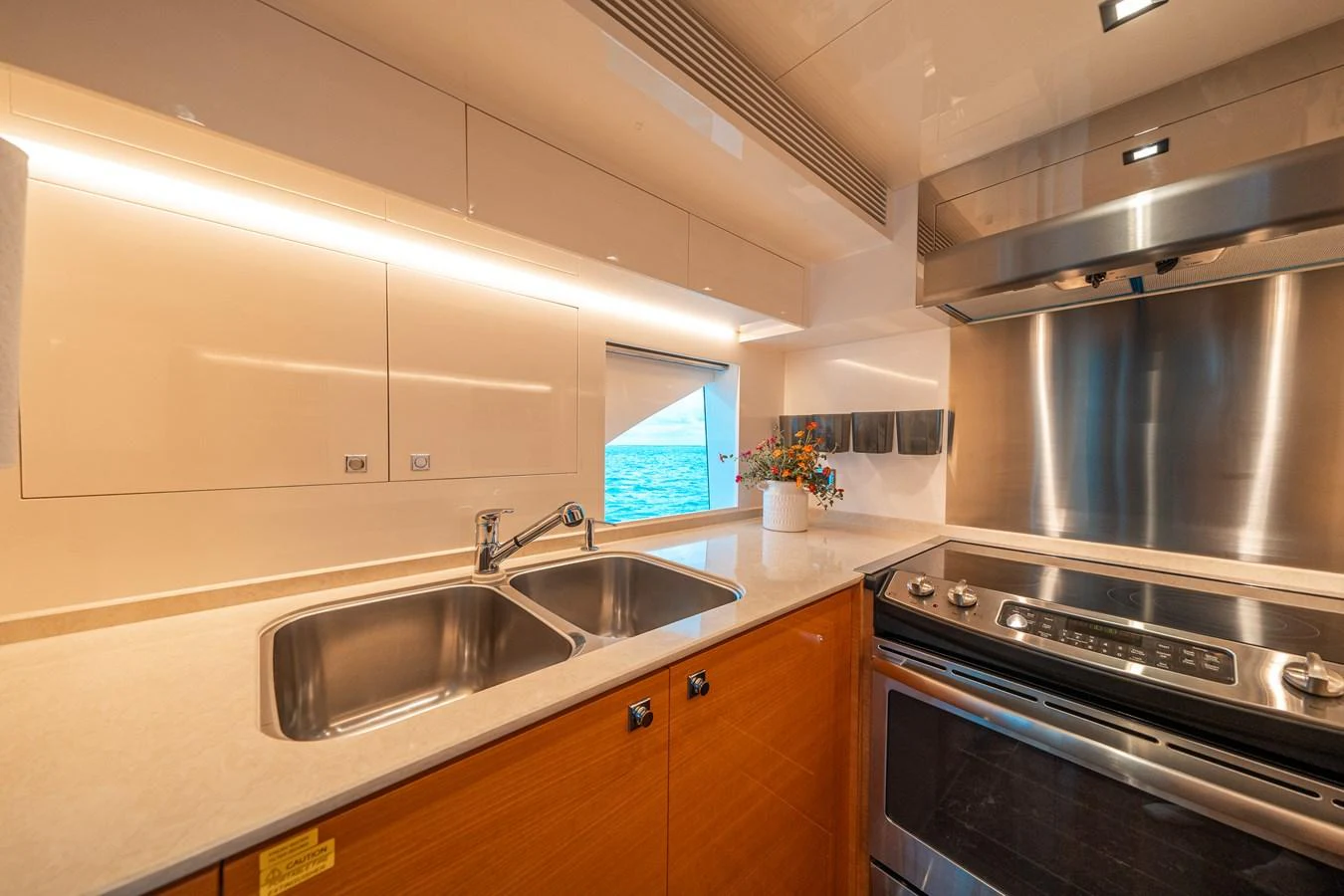 a kitchen with a stainless steel stove aboard MIDNIGHT MOON Yacht for Sale