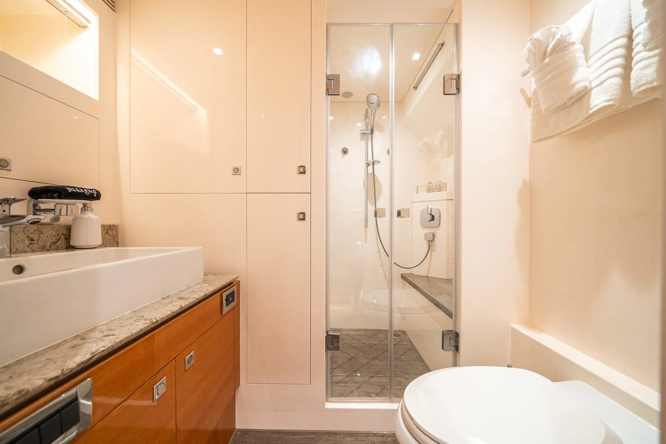 a bathroom with a glass shower aboard MIDNIGHT MOON Yacht for Sale
