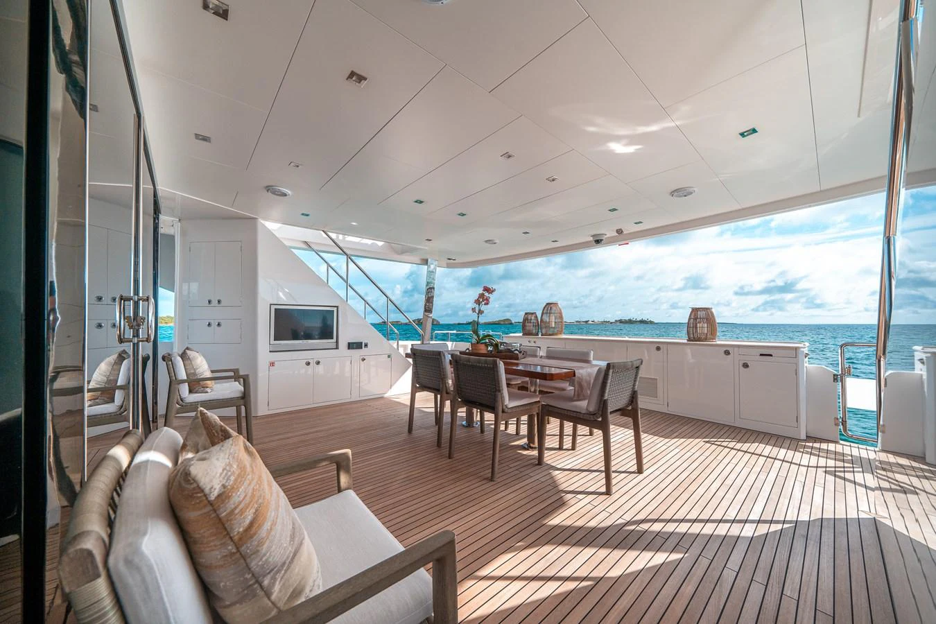 a large living room with a view of the ocean aboard MIDNIGHT MOON Yacht for Sale
