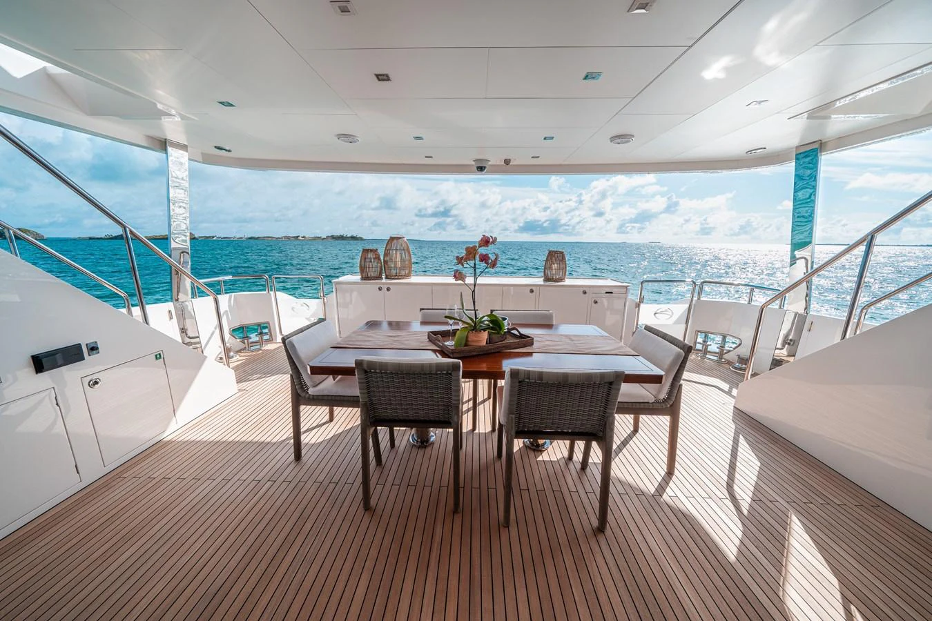 a table and chairs on a boat aboard MIDNIGHT MOON Yacht for Sale