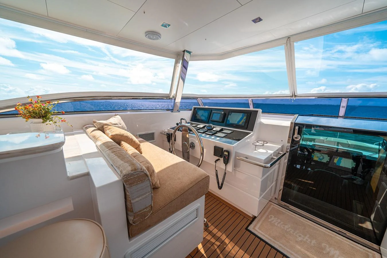 a room with a bed and a desk aboard MIDNIGHT MOON Yacht for Sale