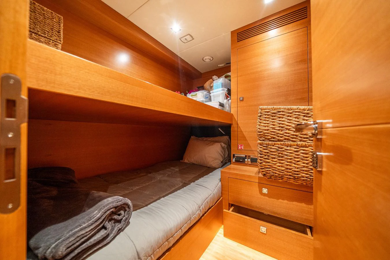 a bed with a wooden headboard aboard MIDNIGHT MOON Yacht for Sale