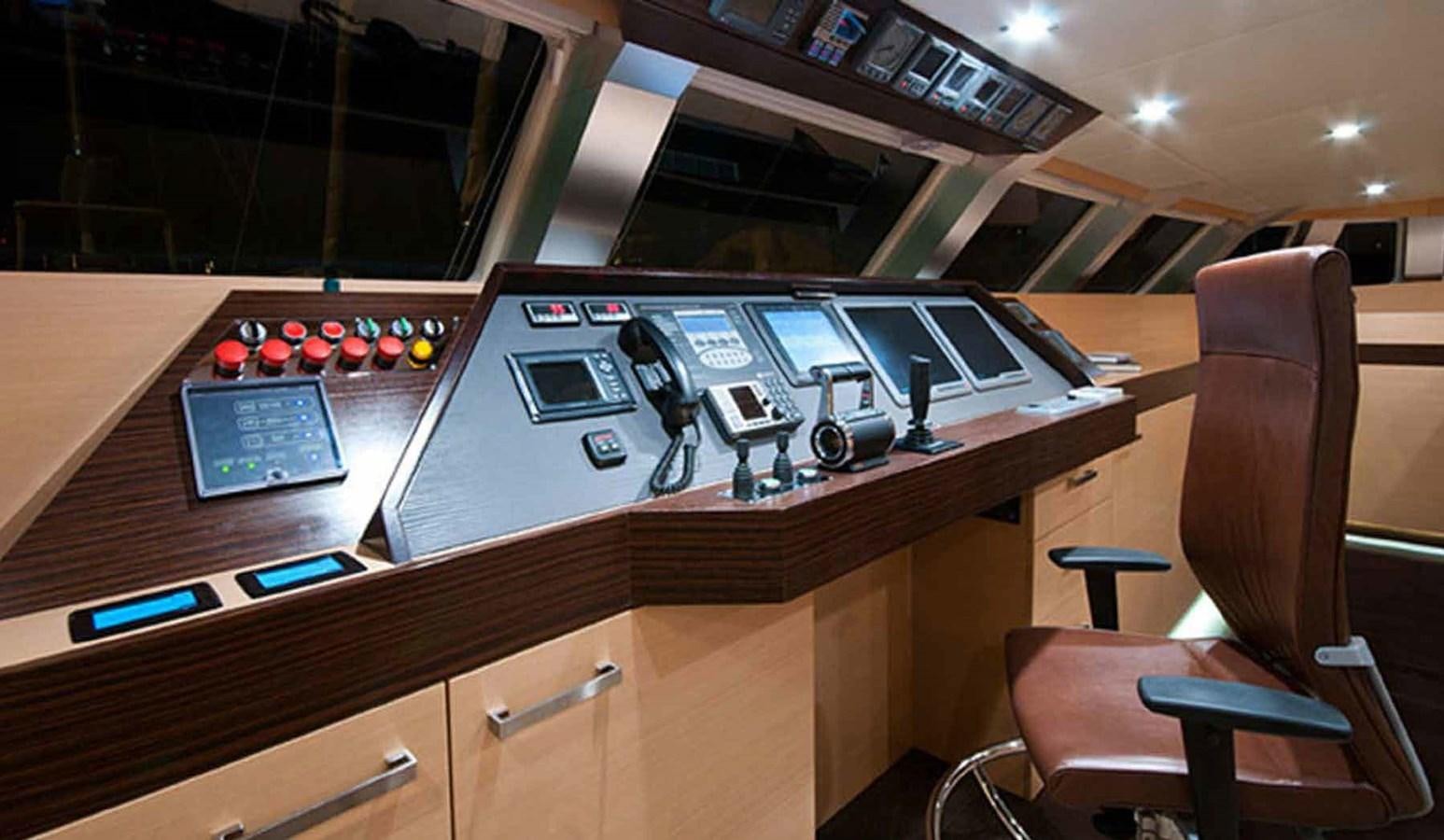a desk with a laptop and a chair aboard IPHARRA Yacht for Sale