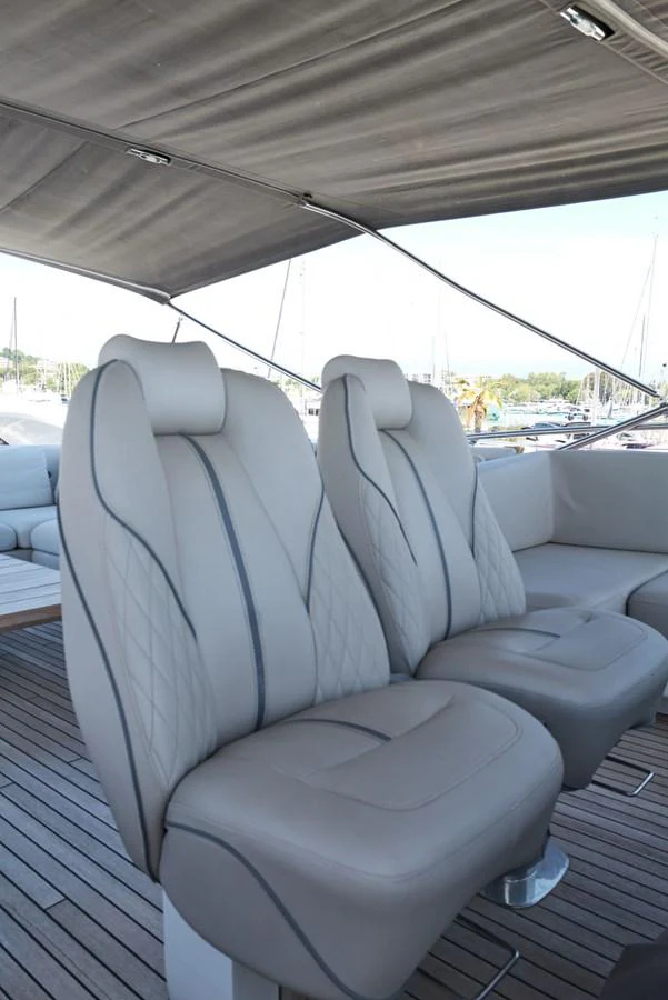a tent with a seat and a seat aboard PRINCESS M Yacht for Sale