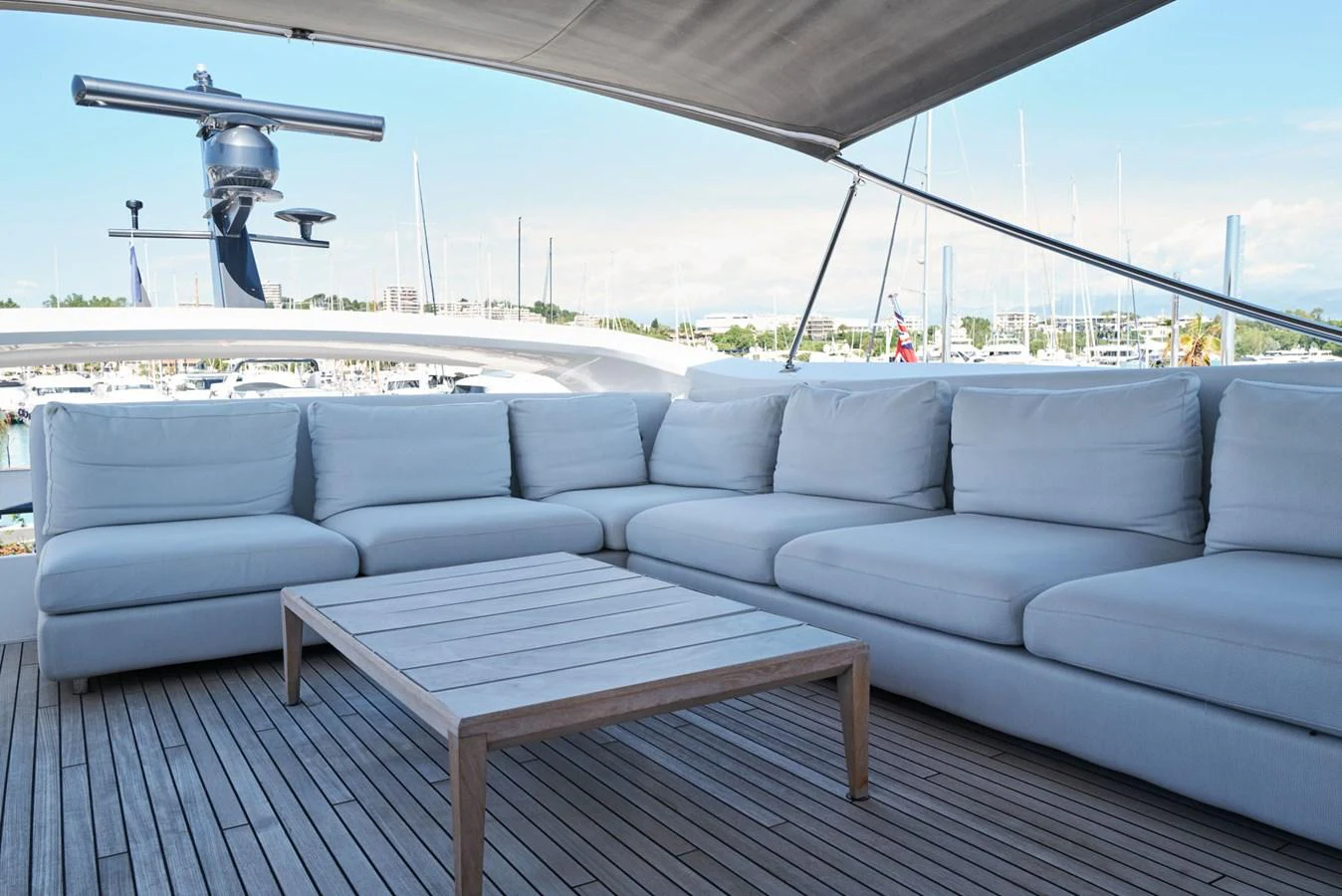 a couch and a table on a deck aboard PRINCESS M Yacht for Sale