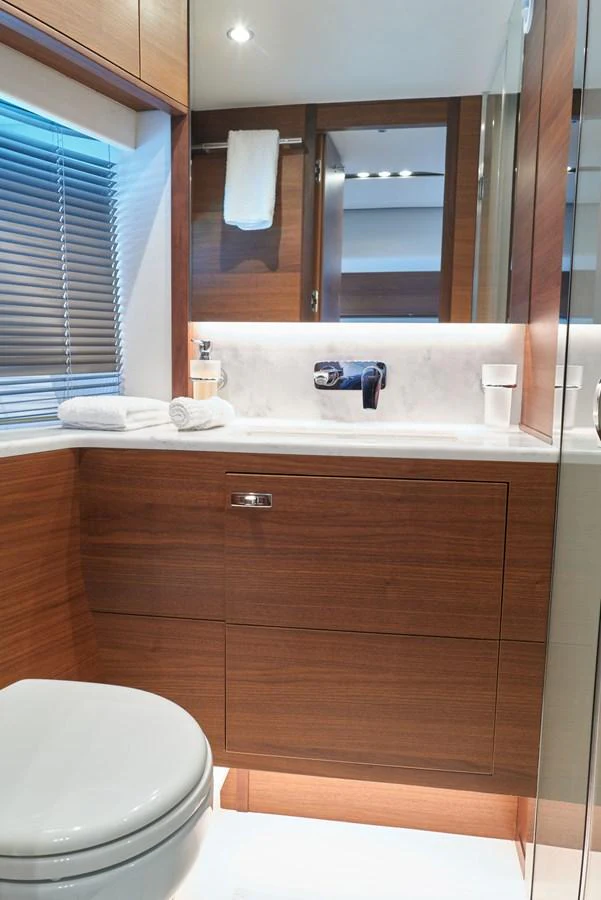 a bathroom with a sink and a toilet aboard PRINCESS M Yacht for Sale