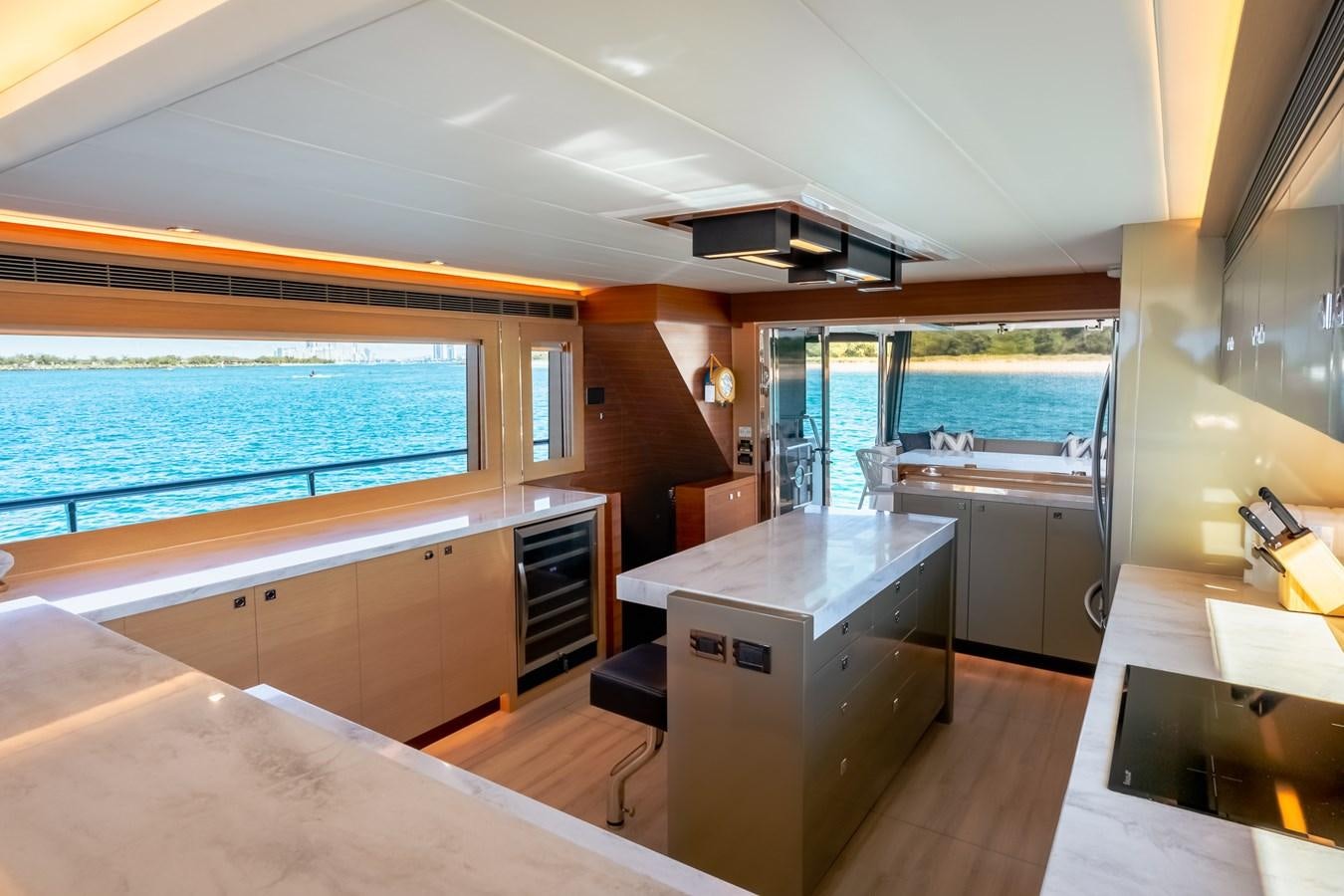 a kitchen with a large window aboard LEGGERA Yacht for Sale
