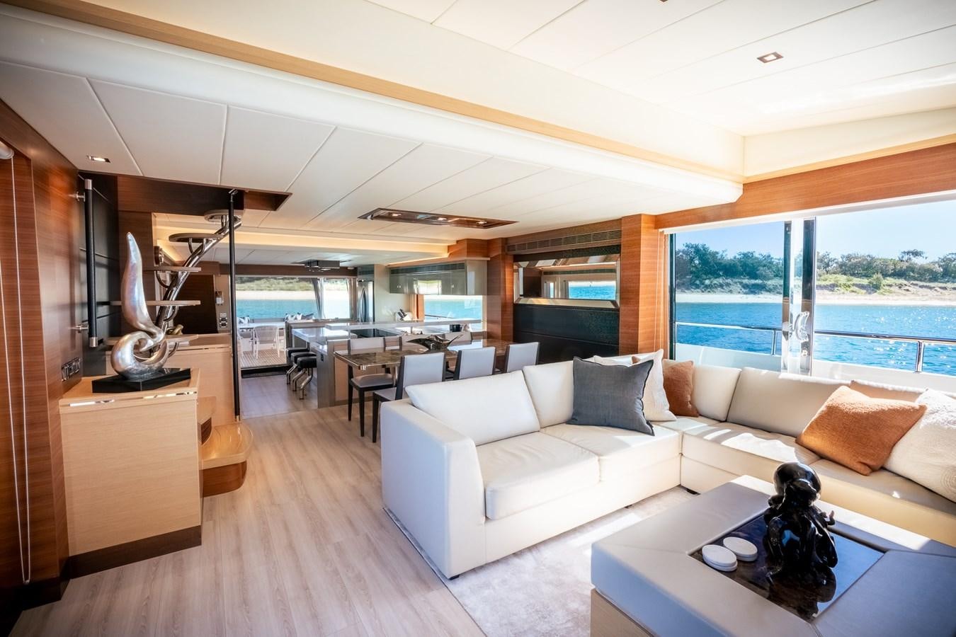 a living room with a large window aboard LEGGERA Yacht for Sale