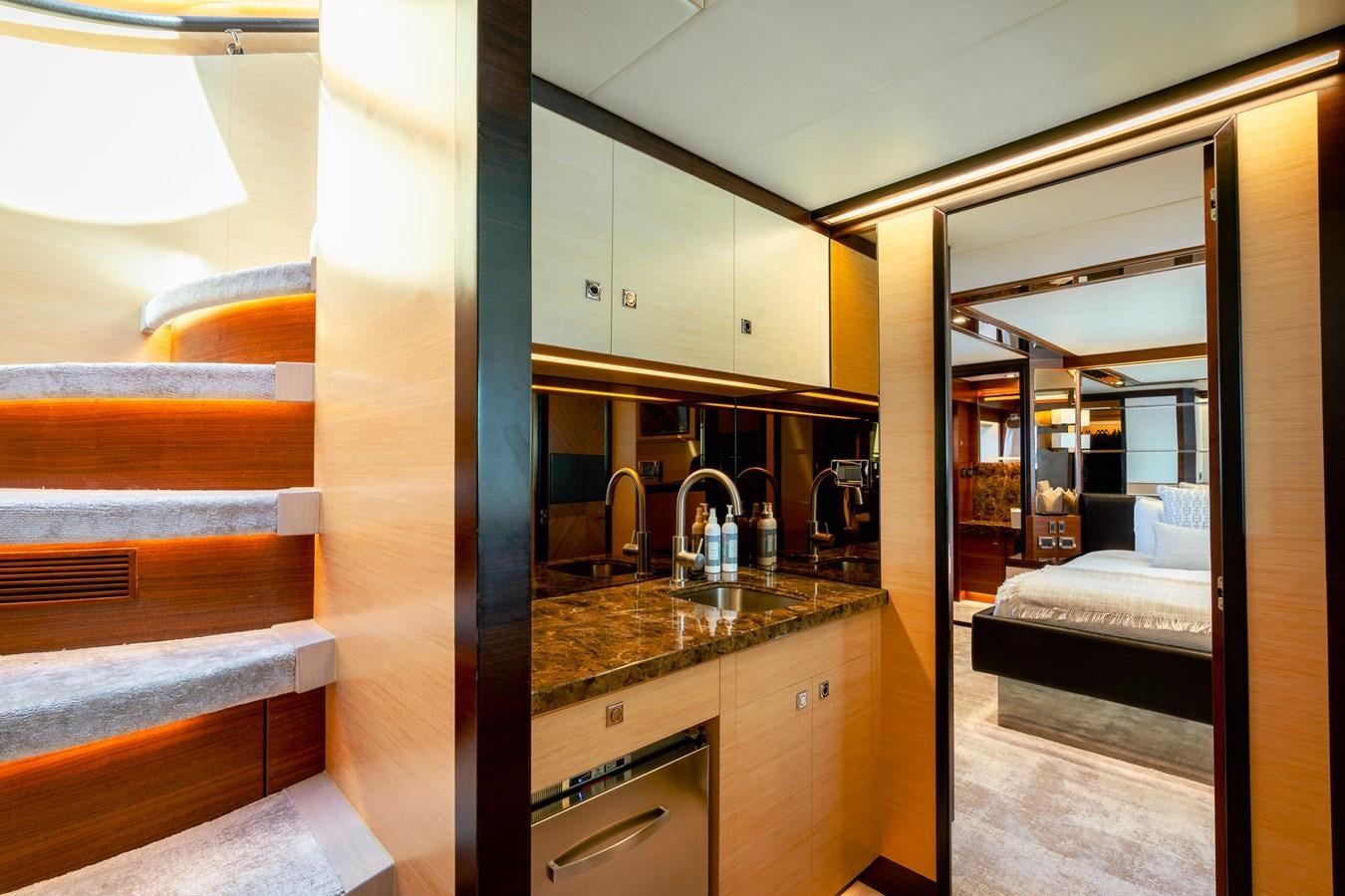 a bathroom with a sink and a bed aboard LEGGERA Yacht for Sale