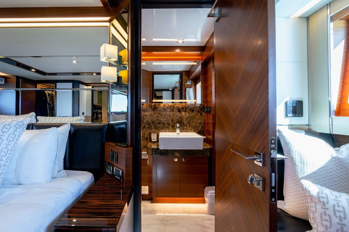 a bathroom with a sink and a bed aboard LEGGERA Yacht for Sale