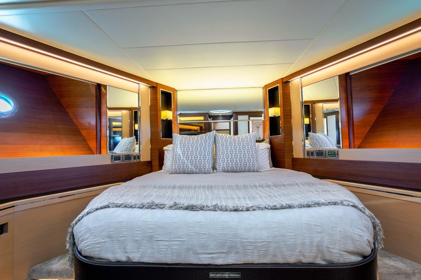 a bed in a room aboard LEGGERA Yacht for Sale
