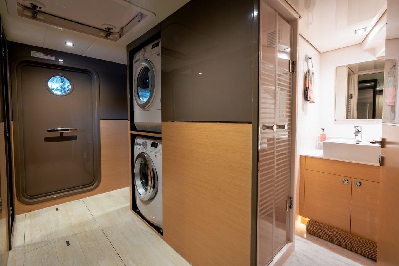 a room with a washer and dryer aboard LEGGERA Yacht for Sale