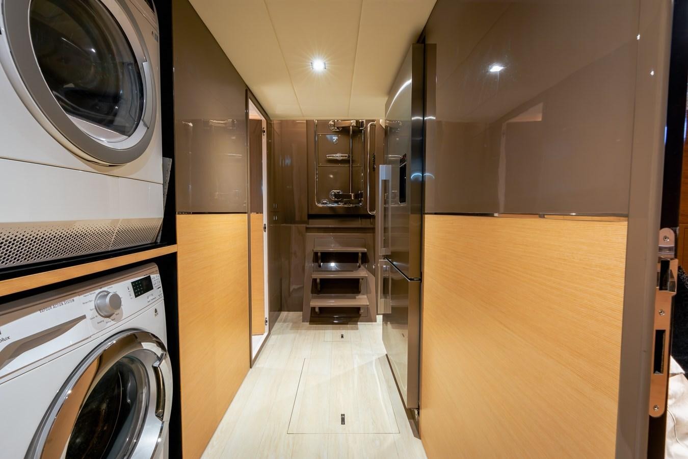 a room with a washing machine and a washer aboard LEGGERA Yacht for Sale