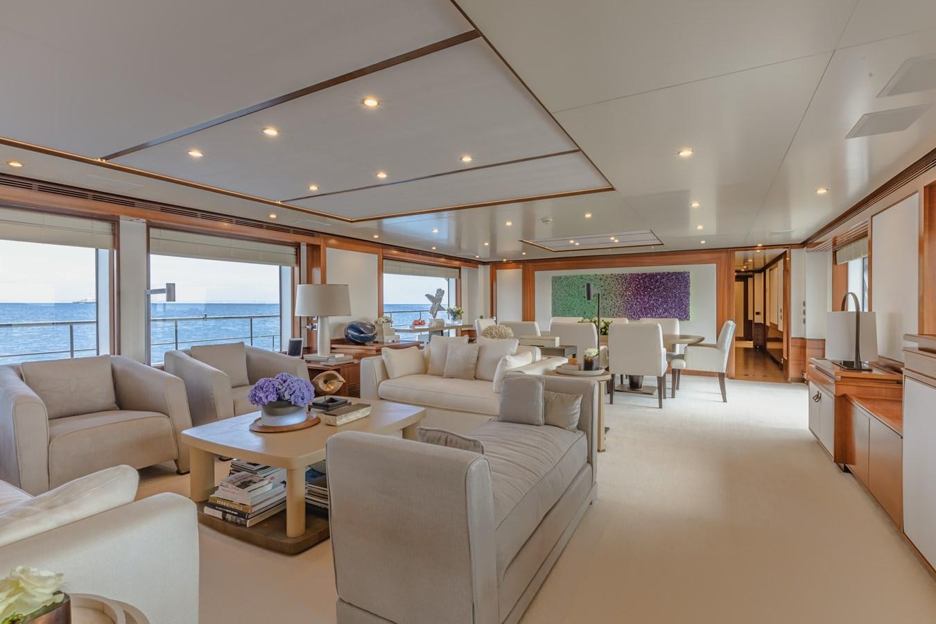 a living room with a large window aboard NEW WAVES Yacht for Sale